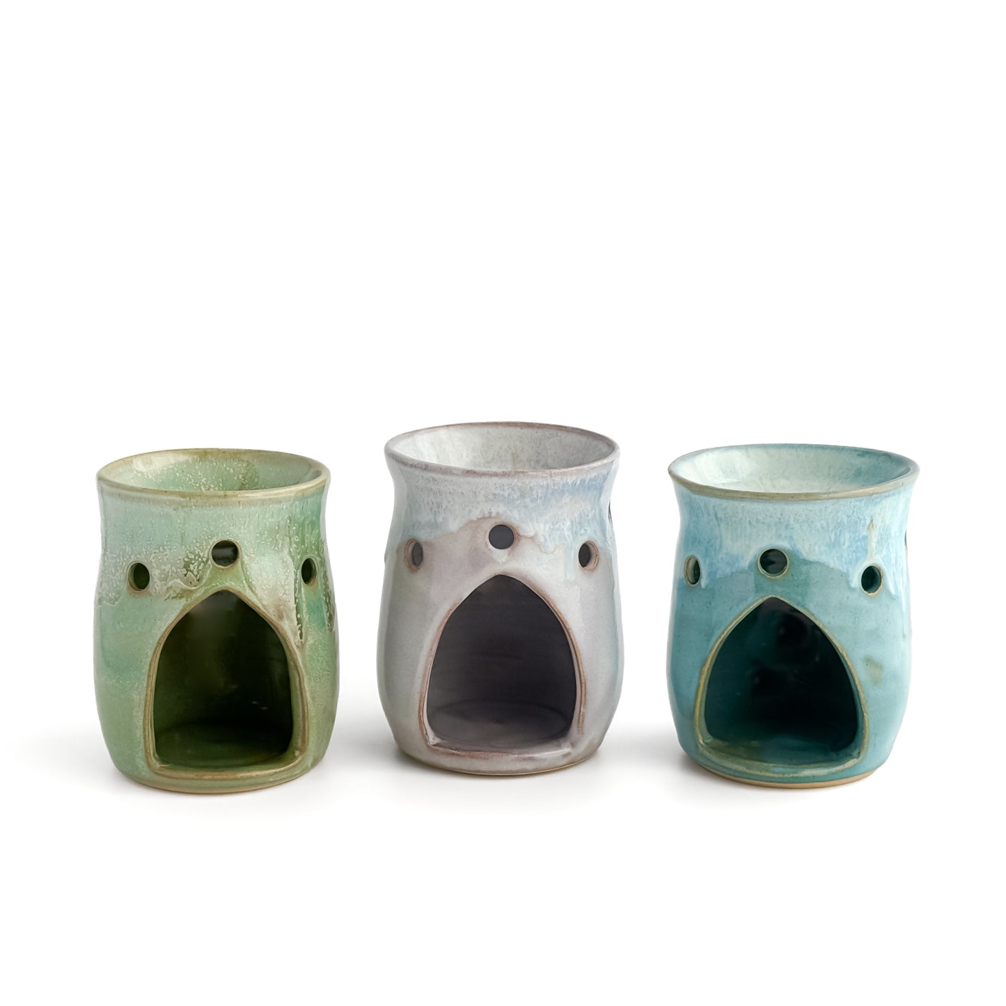 A trio of Leonore wax melt warmers in Hazel Green, Lavender Haze and Azure Blue