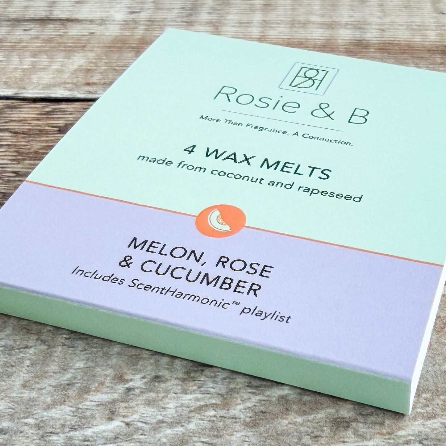 Melon, Rose & Cucumber wax melts sleeve, angled product shot