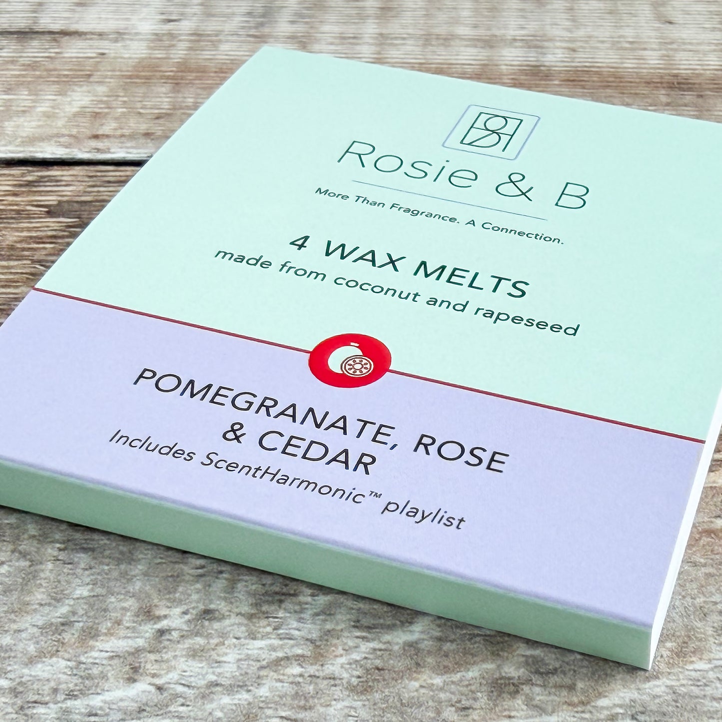Pomegranate, Rose & Cedar wax melts sleeve, angled product shot