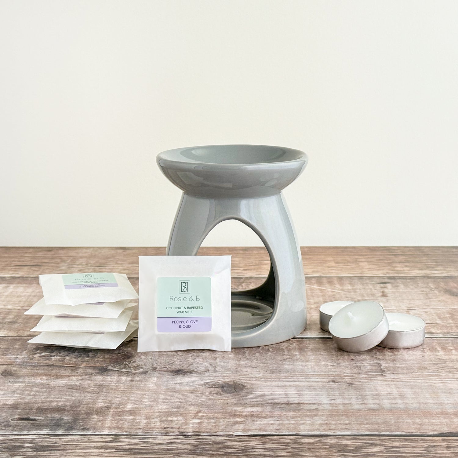 A starter set of a wax warmer, 5 Rosie & B wax melts and 3 tea lights