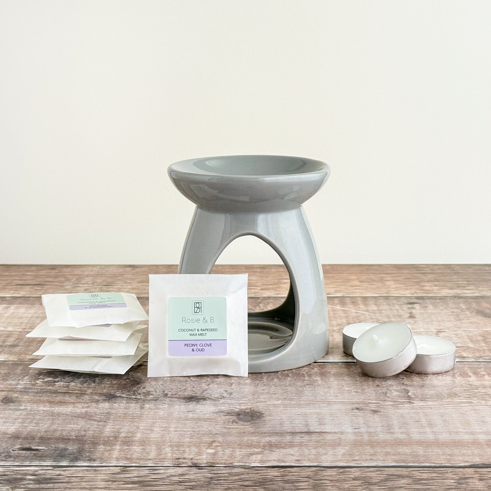 A starter set of a wax warmer, 5 Rosie & B wax melts and 3 tea lights