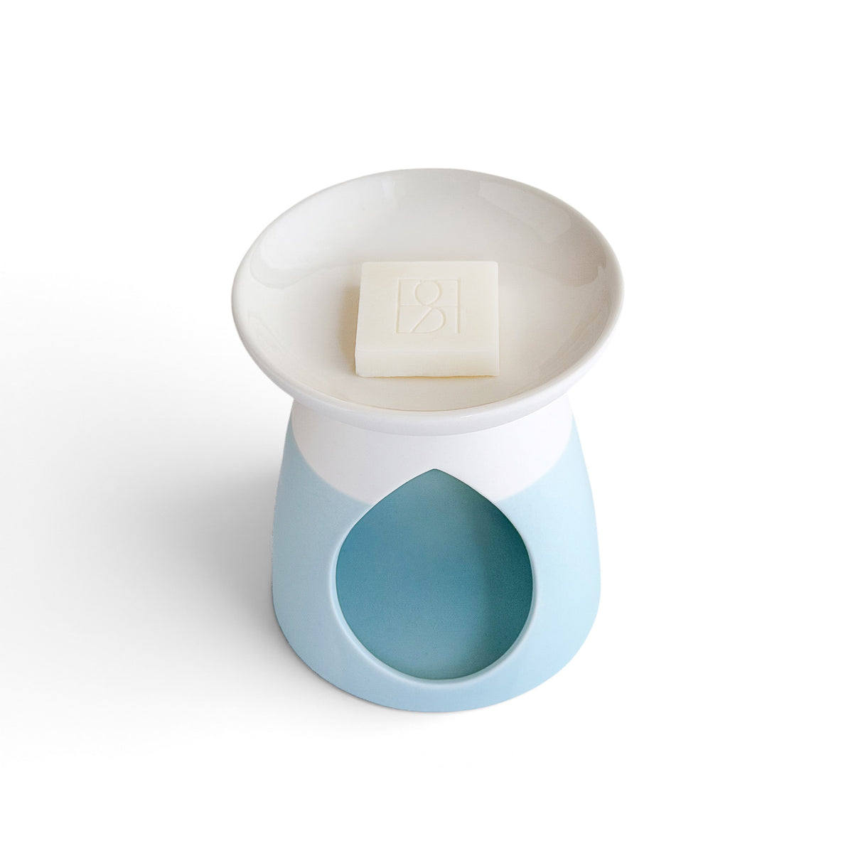 Arabella ceramic wax warmer in powder blue, from above with a Rosie & B wax melt