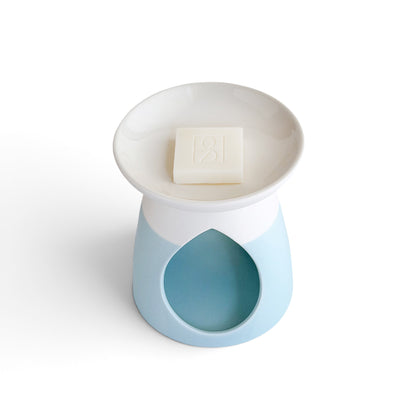 Arabella ceramic wax warmer in powder blue, from above with a Rosie & B wax melt