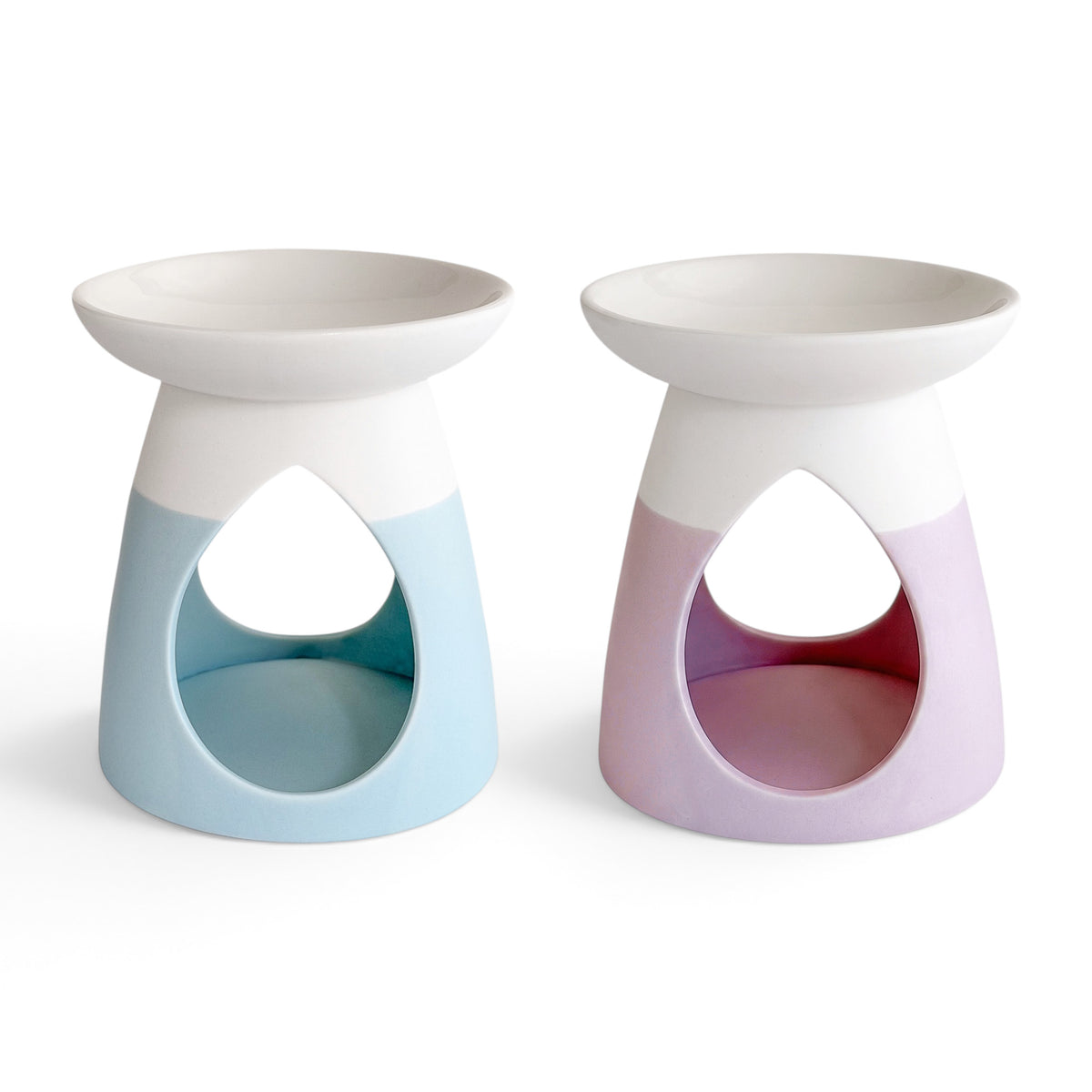 Two Arabella ceramic wax warmers in powder blue and powder pink