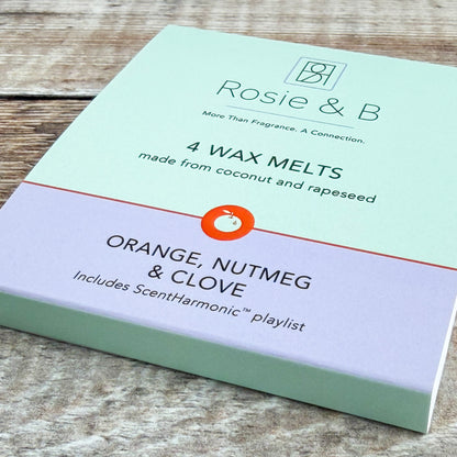 Orange, Nutmeg & Clove wax melts sleeve, angled product shot