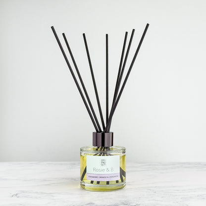 Cranberry, Orange & Cinnamon reed diffuser bottle with reeds