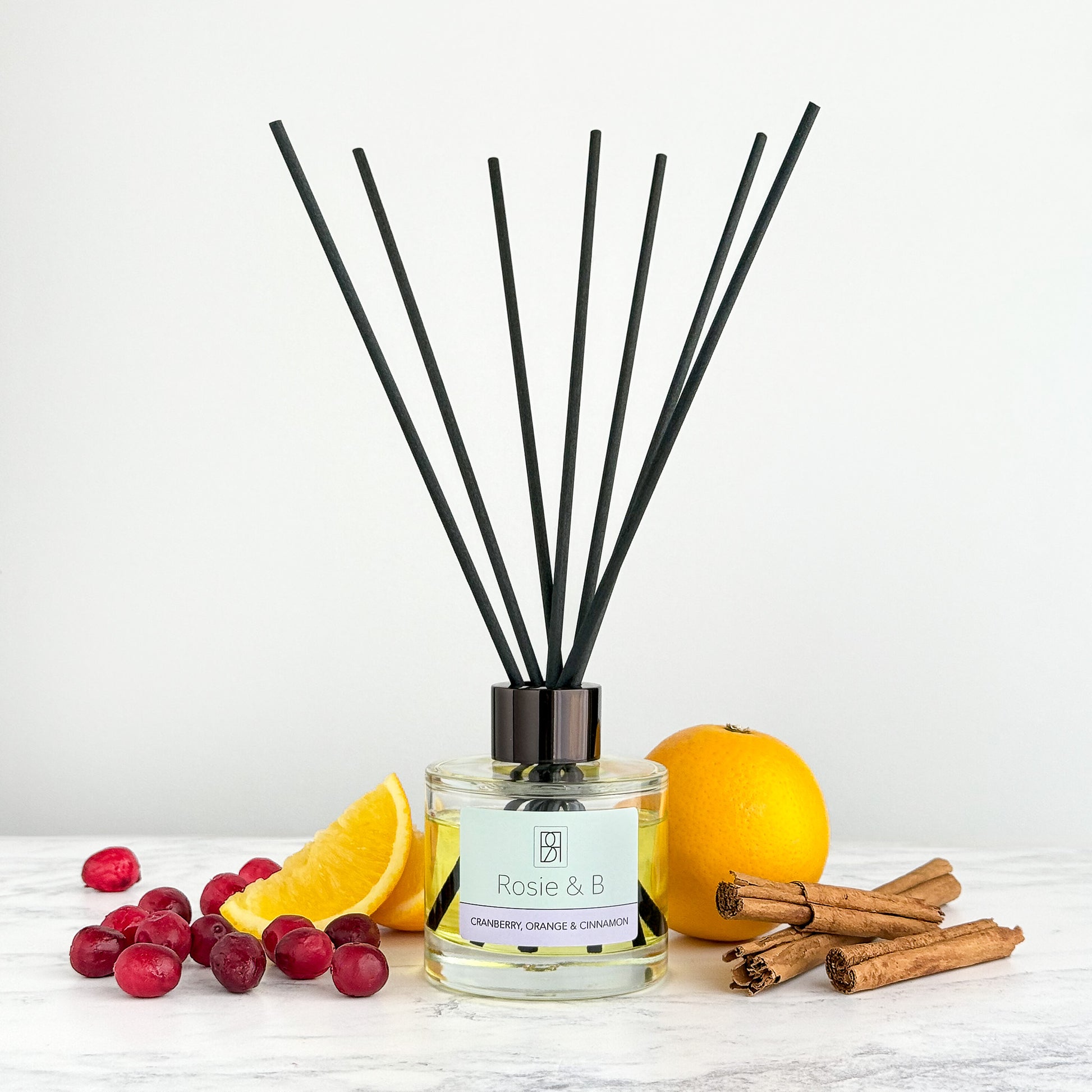 Cranberry, Orange & Cinnamon reed diffuser, styled photo