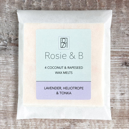 A packet of four Lavender, Heliotrope & Tonka wax melts on a wooden background